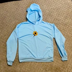 Blue hoodie with a sunflower embroidered